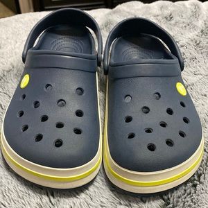 Crocs blue with yellow/green stripe at bottom